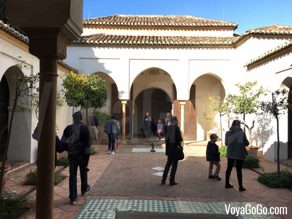 Shows the courtyard garden of the Cuartos de Granada.  Part of the Alcazaba of Málaga.  Voyagogo.com Travel Blogs.