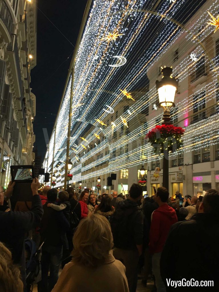 Shows the central shopping street of Calle Larios in Malaga City, during the nightly Christmas light show.  Voyagogo.com - Travel Blogs
